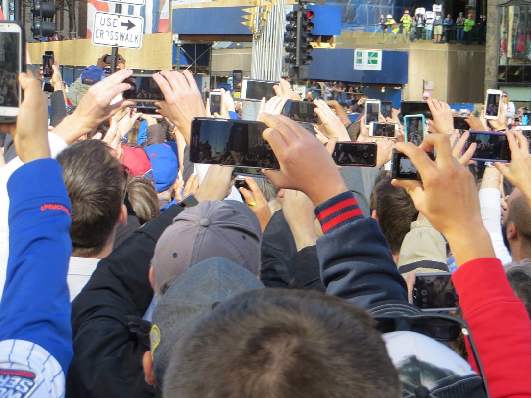 A crowd using smartphones